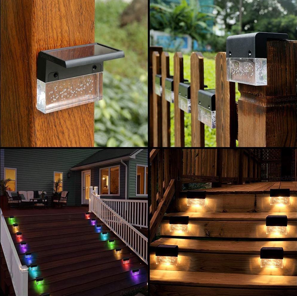 Solar-powered outdoor lights on wooden posts, railings, and steps with a blurred background. Solar Deck Lights - Automatic Dusk to Dawn Operation | Smart Glow Connect