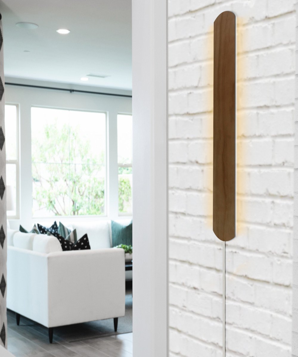 Solid wood wall light showing plug-in cord and installation