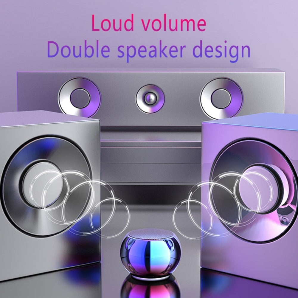 Purple and silver speakers with 'Loud volume' and 'Double speaker design' text on a purple background. Mini Bluetooth Speaker in Hand - Ultra Portable Size | Smart Glow Connect