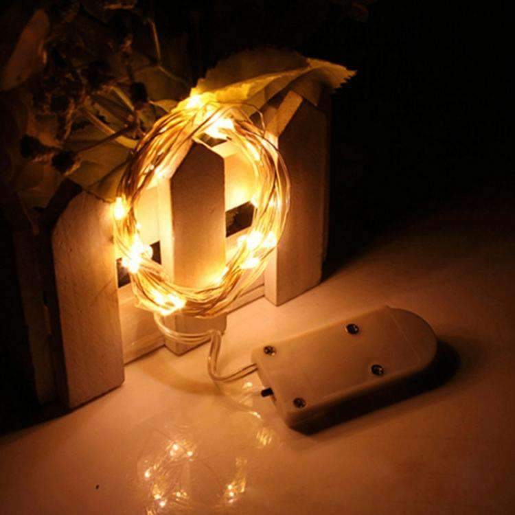 LED fairy string lights showing button battery compartment