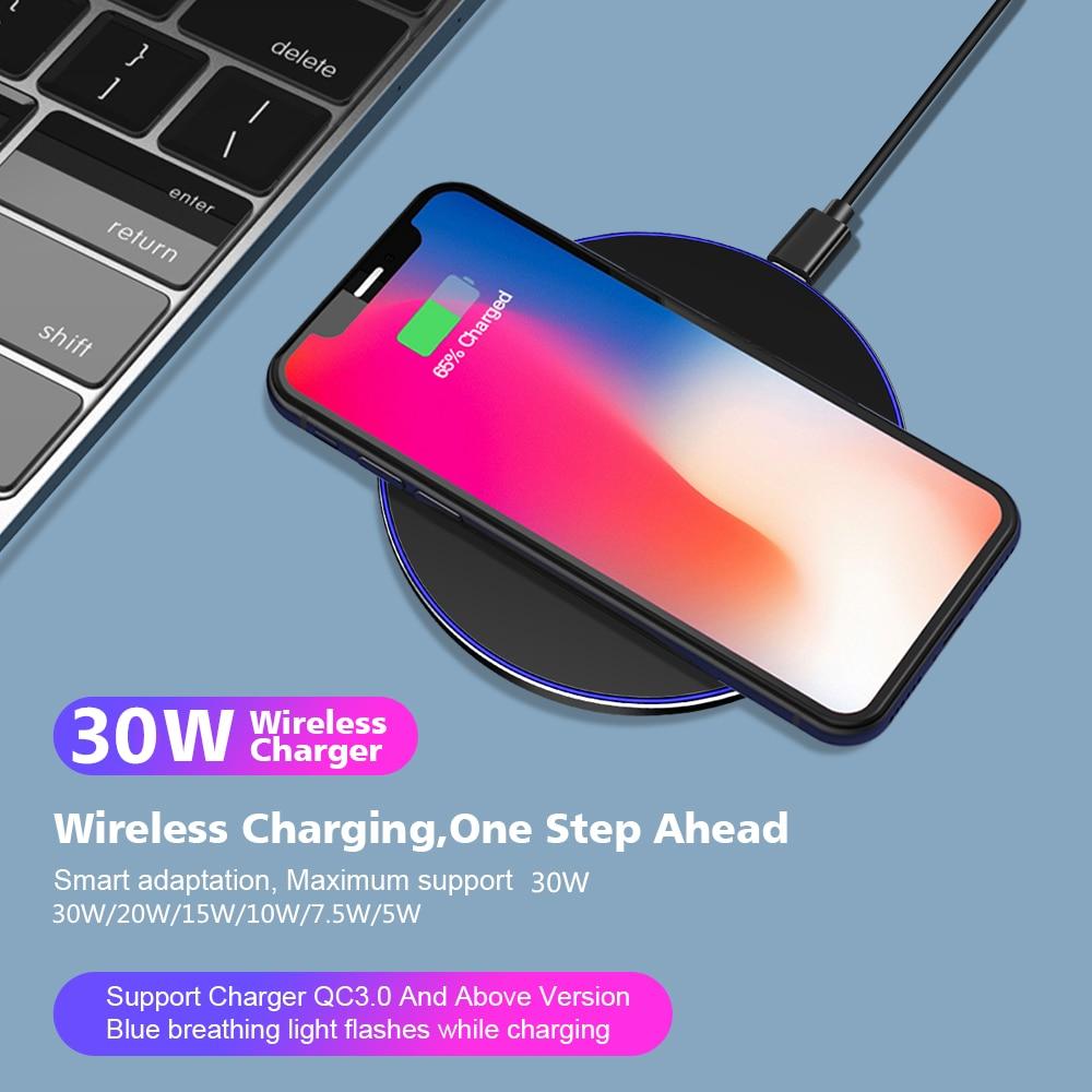 Wireless charger with smartphone on a blue surface, showing charging process. 30W Fast Charging Pad - Compatible with All Qi Devices | Smart Glow Connect